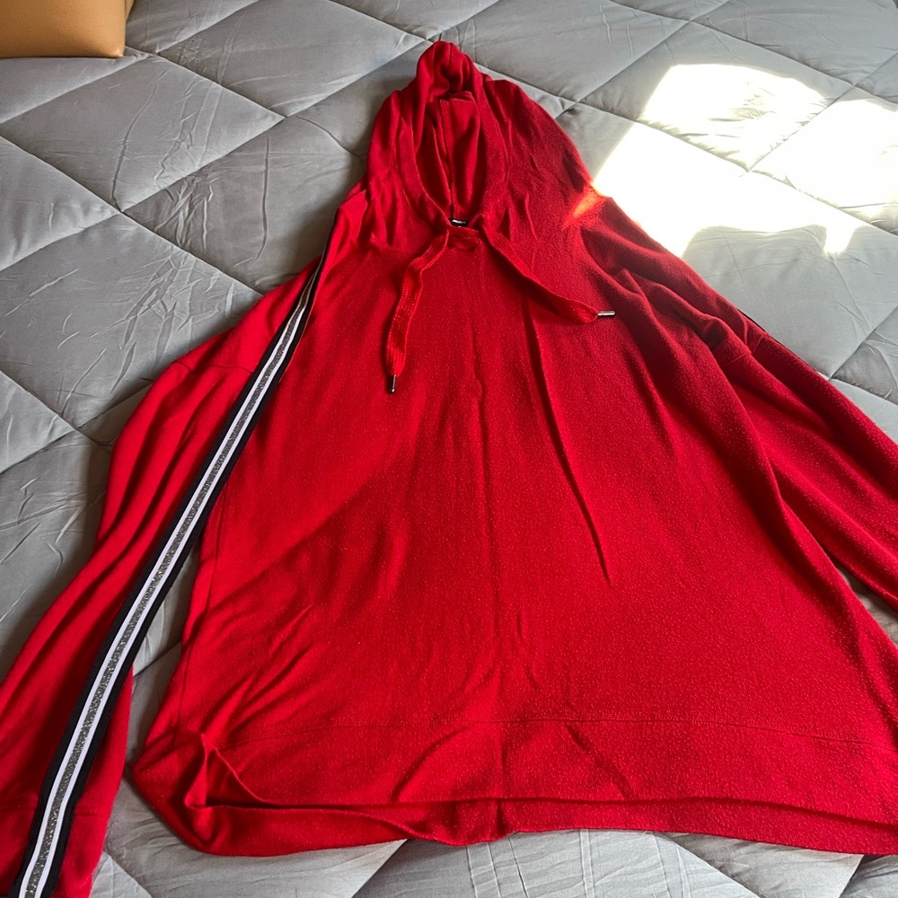 Ardene Bold Red Hoodie has silver glitter detailing on sleeves .